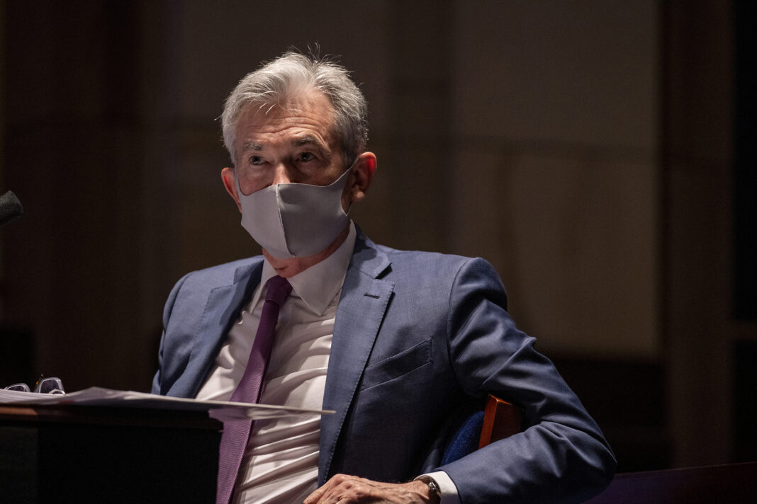 FILE PHOTO: Federal Reserve Chair Jerome Powell, wearing a face mask, testifies before the House of Representatives Financial Services Committee during a hearing on oversight of the Treasury Department and Federal Reserve response to the outbreak of the coronavirus disease (COVID-19), on Capitol Hill in Washington, U.S., June 30, 2020. Tasos Katopodis/Pool via REUTERS/File Photo